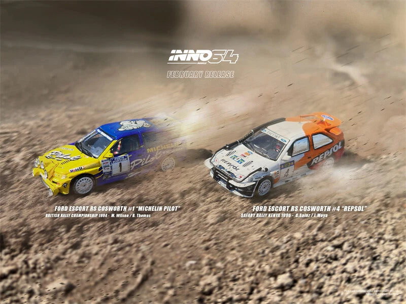 1:64 rally model cars, blue and orange/white with sponsor decals, side-by-side on road
