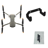 Black wall mount bracket with mounting screws for drone