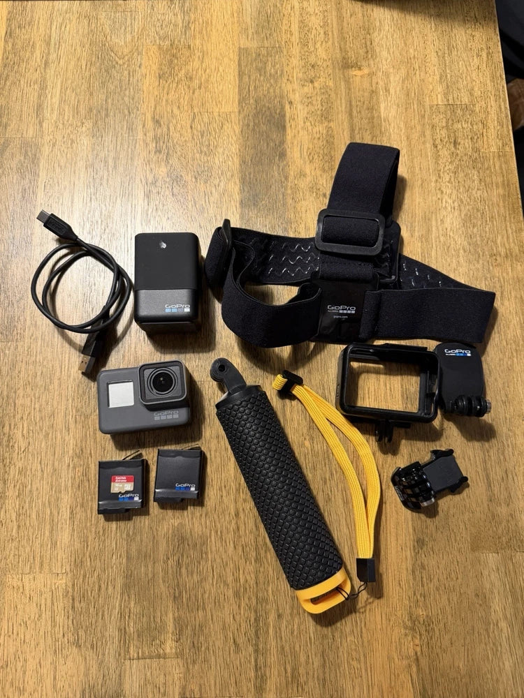 GoPro HERO5 Black action camera kit with head strap, mount, charger, and two SD cards