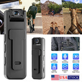 Mini police body camera with front lens and side clip, dark gray housing