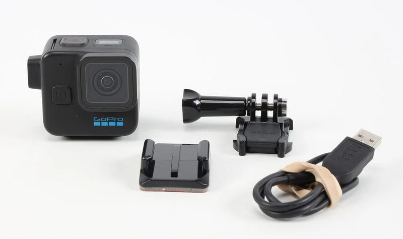 GoPro HERO11 Black mini action camera with mount, tripod grip, and USB cable