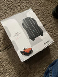 Foldable quadcopter FPV drone in retail box, showing black camera drone