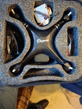 RC quadcopter drone with four black prop arms and 'Dane' marking on body