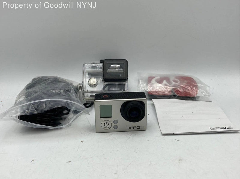 GoPro HERO action camera with LCD screen and waterproof housing plus accessories