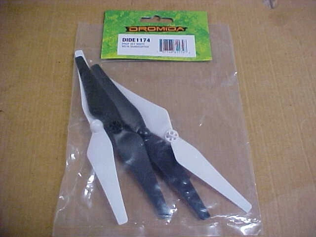 Quadcopter propeller set with four white and black blades in clear bag