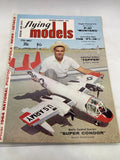 Flying Models magazine cover with radio control aircraft and biplane artwork