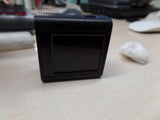 Black action camera with front display screen, compact square body
