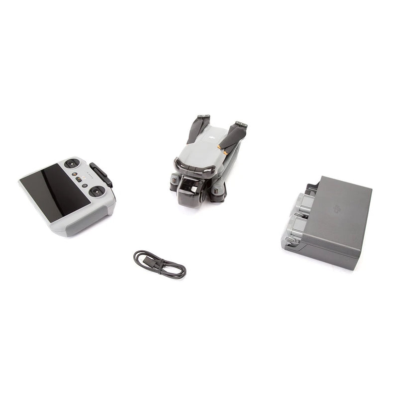 Drone accessories kit with RC controller, USB cable, batteries, and storage case