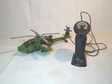 Green remote control helicopter with black handheld transmitter controller