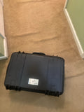 Black hard waterproof case for drone, with molded edges and latch