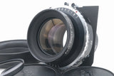 Black camera lens with front glass, engraved Fuji Fujinon text, Copal shutter