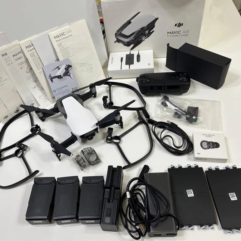 DJI Mavic Air Fly More Combo drone kit with controller, batteries, cables, manuals