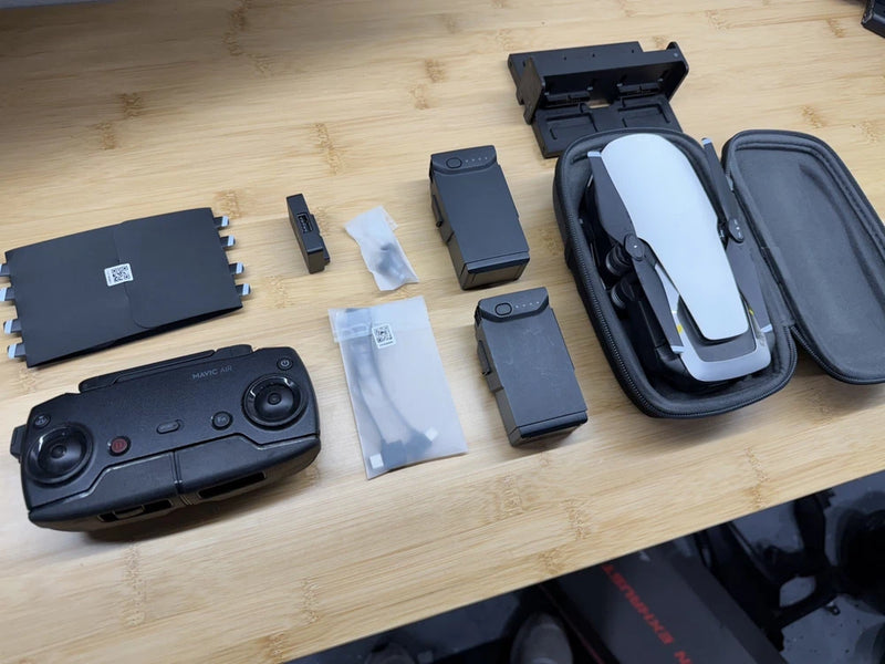 Arctic white DJI Mavic Air drone with controller and protective travel case