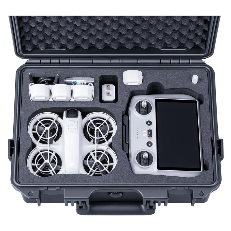 Waterproof hard case with foam insert holding drone controller and remote, open lid