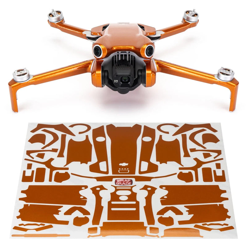 WRAPGRADE drone with orange arms and front camera, with orange decal wrap sheet