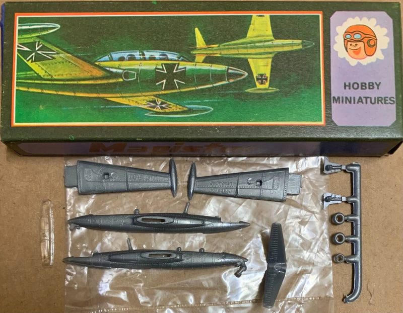 Plastic model plane kit with gray jet parts on sprues, in a Hobby Miniatures box