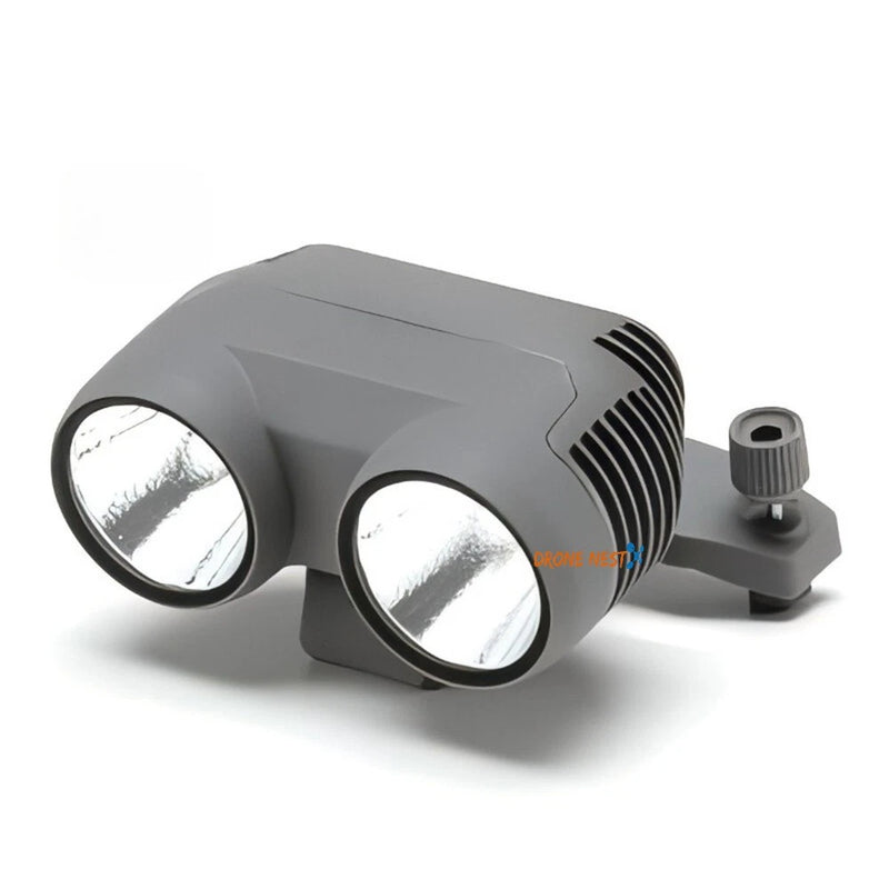 Grey dual-lens drone spotlight accessory with adjustable mount knob and vented housing