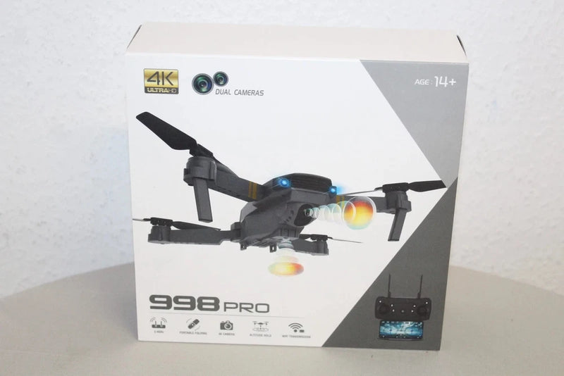 Foldable 4K dual-camera drone box with black quadcopter and controller