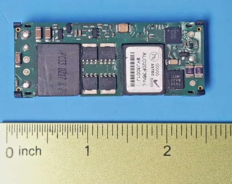DC DC converter module PCB with electronic components and four mounting holes