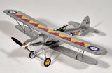 Grey RC airplane model with colorful fuselage stripes, open landing gear, and propeller
