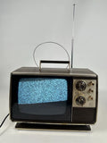 Vintage Zenith TV with antenna and blue screen