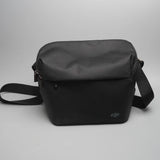 Black DJI shoulder bag with adjustable strap and zip top, for drone accessories