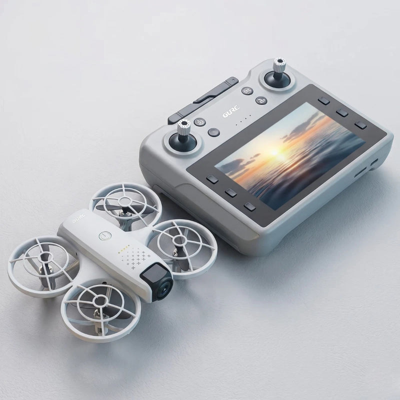 Gray RC quadcopter drone with camera, paired with handheld remote controller