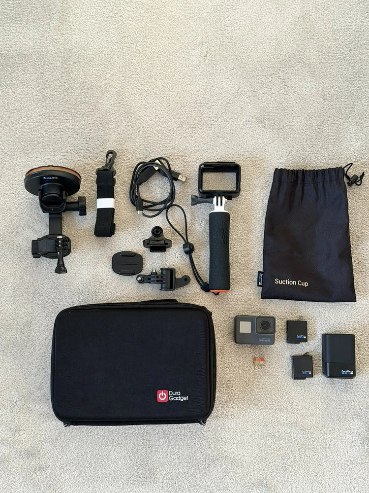 GoPro HERO5 4K action camera bundle with camera, mounts, batteries, and carrying case