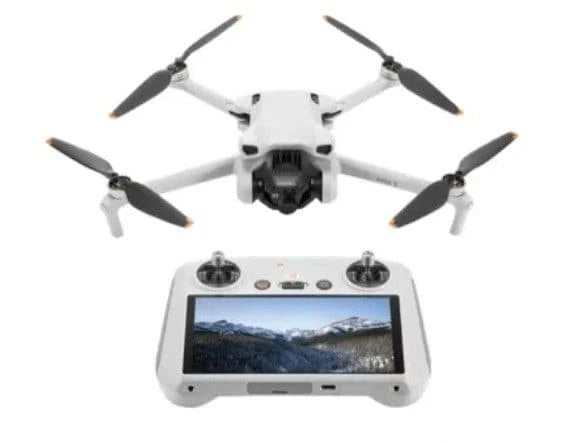 White quadcopter drone with front camera and smart controller with display