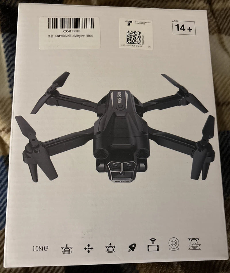 Black mini quadcopter drone with propellers and front camera