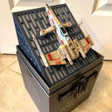 Collector's edition X-wing high-performance drone in open display box, blue-and-white wings