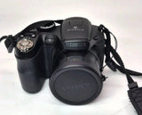 FUJIFILM FinePix S2950 digital camera, black body with lens cap and wrist strap