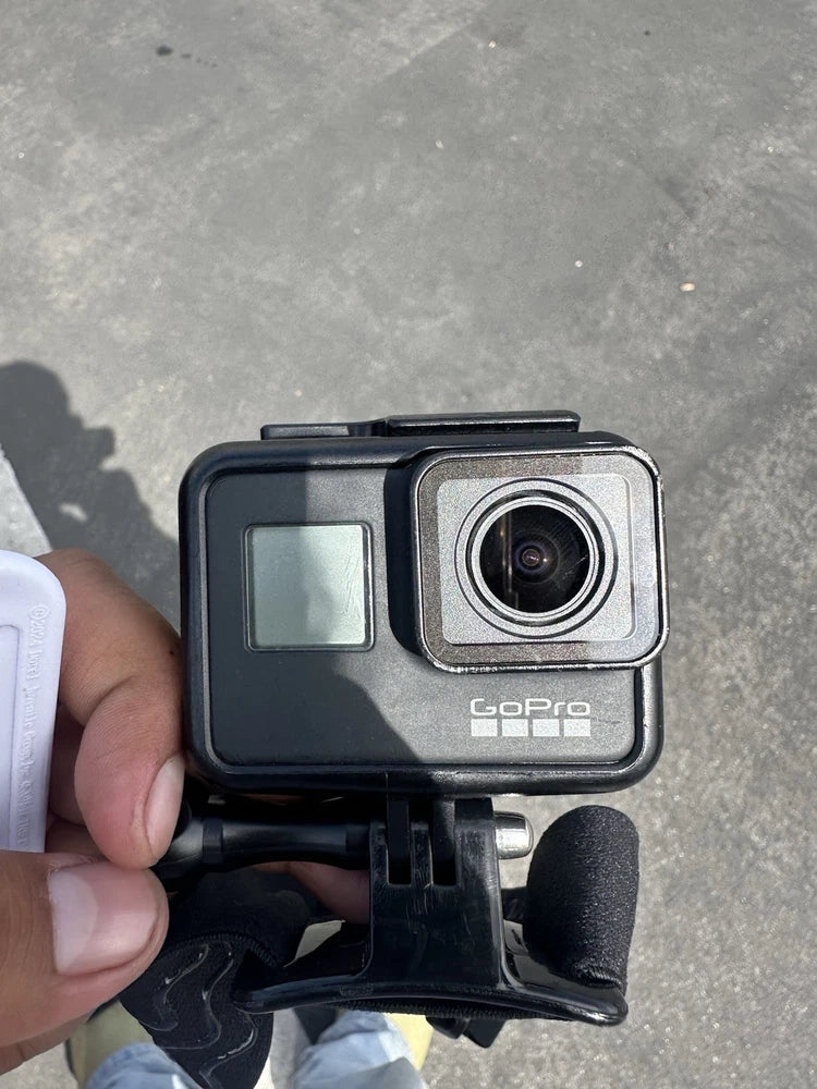 GoPro action camera in black case with front lens and small LCD screen