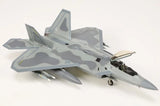 Gray camouflaged F-22A Raptor model jet with landing gear extended, side view