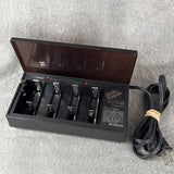 Vintage nickel-cadmium battery charger, open slots, red indicators, power cord