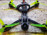 5-inch FPV freestyle drone with green propellers