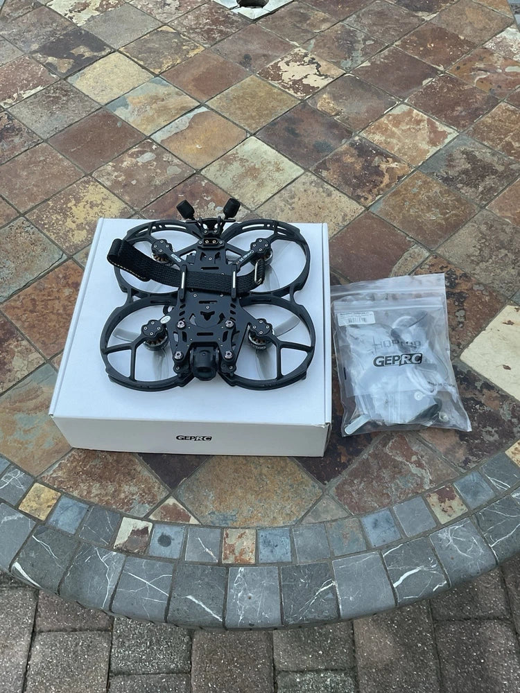 GepRC FPV drone with propellers in retail box, black frame
