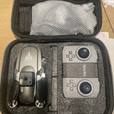 Foldable FPV quadcopter drone with dual camera lenses in open carry case