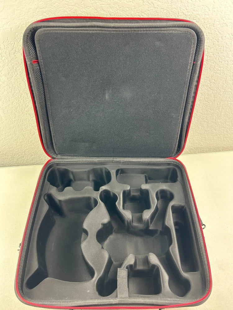Soft drone case with molded foam insert, open with zipper top