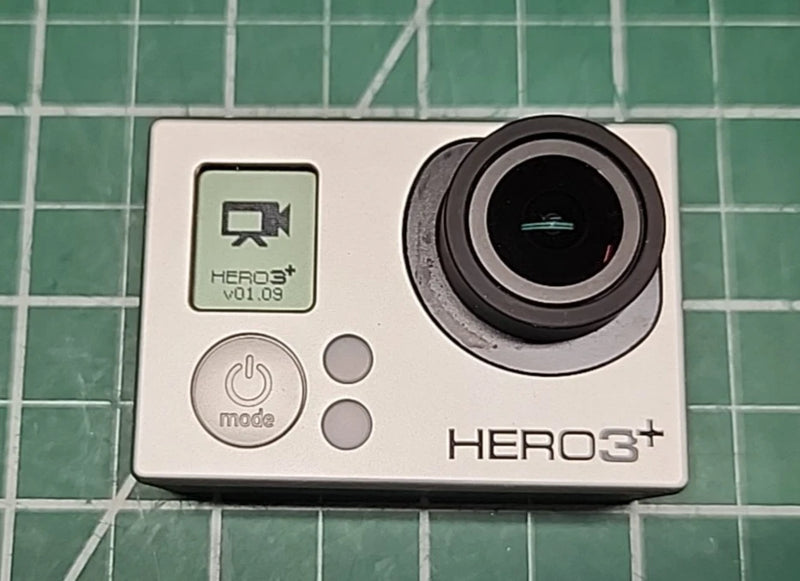 GoPRO HERO3+ action camera with front buttons and large circular lens, white body