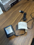 Black RC battery charger power adapter with connected cables and printed label
