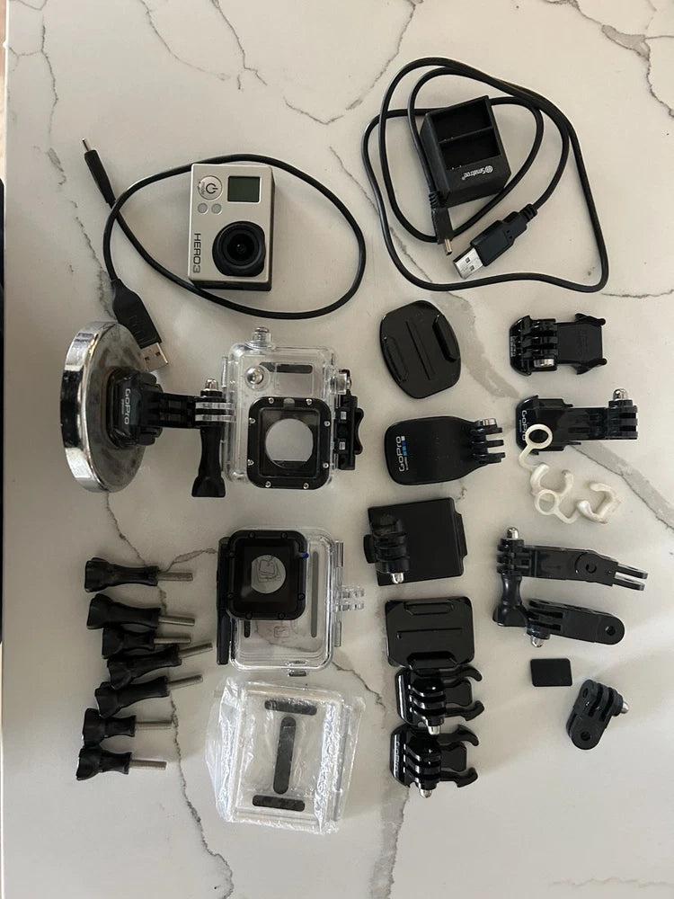 GoPro HERO3 action camera kit with waterproof cases and multiple mounting accessories