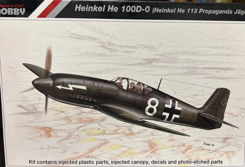 1/72 Heinkel He 100D-0 model kit with dark gray aircraft fuselage and 8 red markings