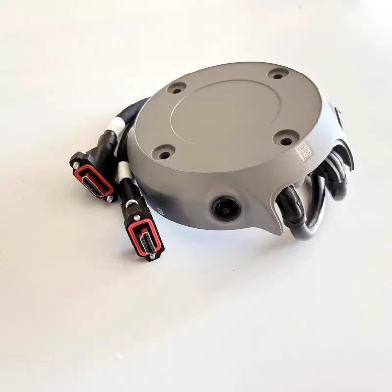 Four-lens fisheye vision sensor module with grey housing and cable connectors