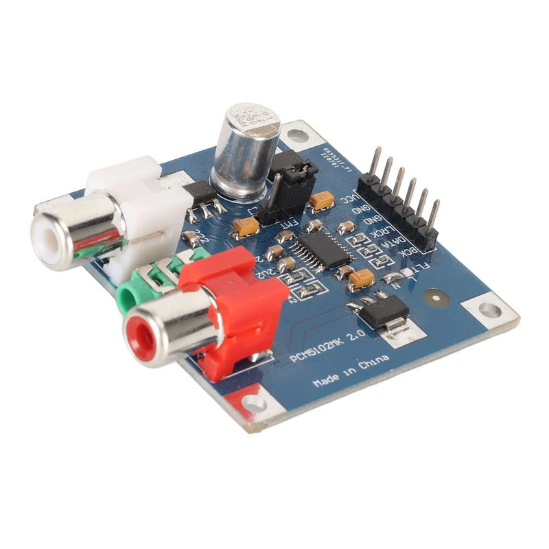 DAC decoder board with 3.5mm headphone jack, RCA inputs, and blue PCB with components