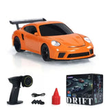 Orange mini remote control drift racing car model with controller, accessories, and box
