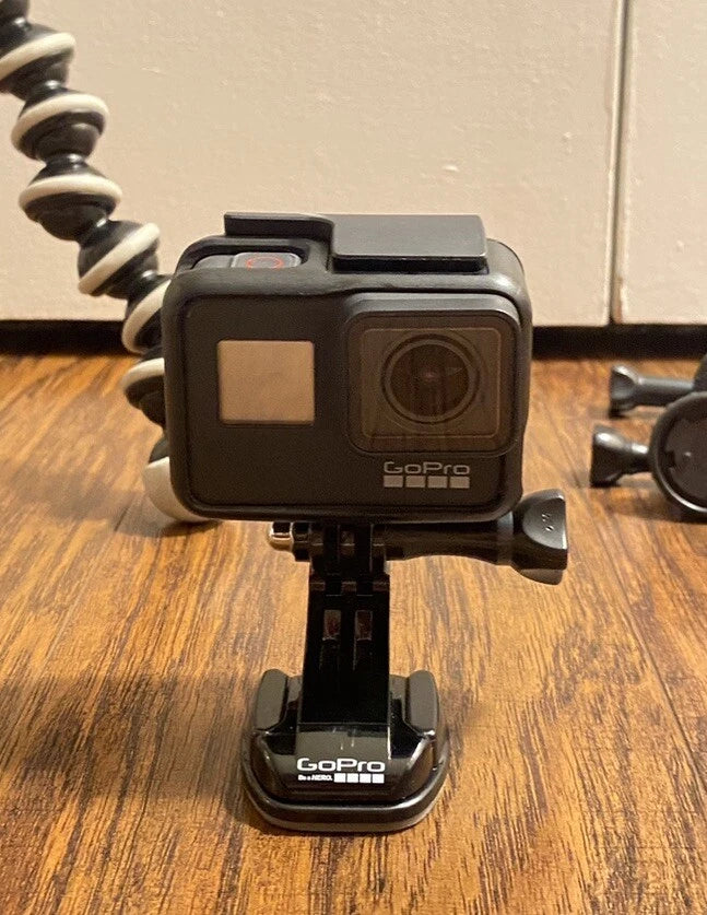 GoPro Hero7 Black action camera with front lens and compact mounting base
