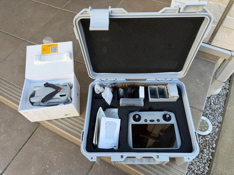 DJI Mini 3 Fly More Combo Plus drone kit in open hard case with remote and accessories