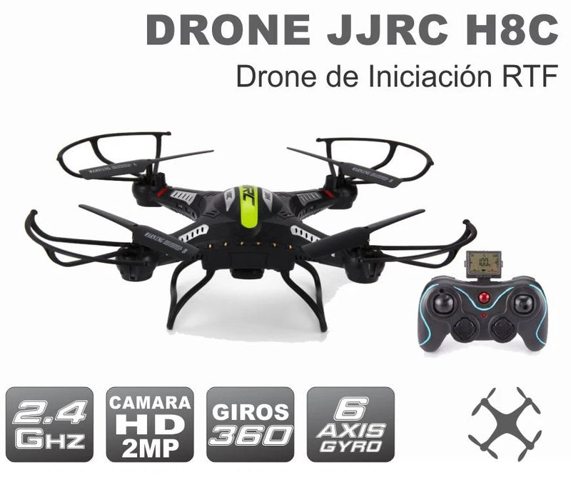 Quadcopter drone with remote controller, black with green accents, four propeller arms