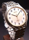 SEIKO DOLCE round wristwatch with silver stainless steel bracelet and white dial